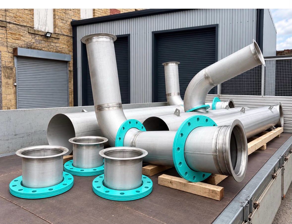 Stainless steel pipework spools, bends and flanged connections fabricated by Willand Engineering for a sewage treatment works, loaded for delivery from the Halifax workshop